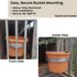 metal bucket holder with an orange 2 gallon bucket attached to a dog box