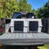 The Original By Easy Loader Dog Kennels on the back of a pickup truck