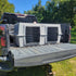 The Original By Easy Loader Dog Kennels on the back of a pickup truck