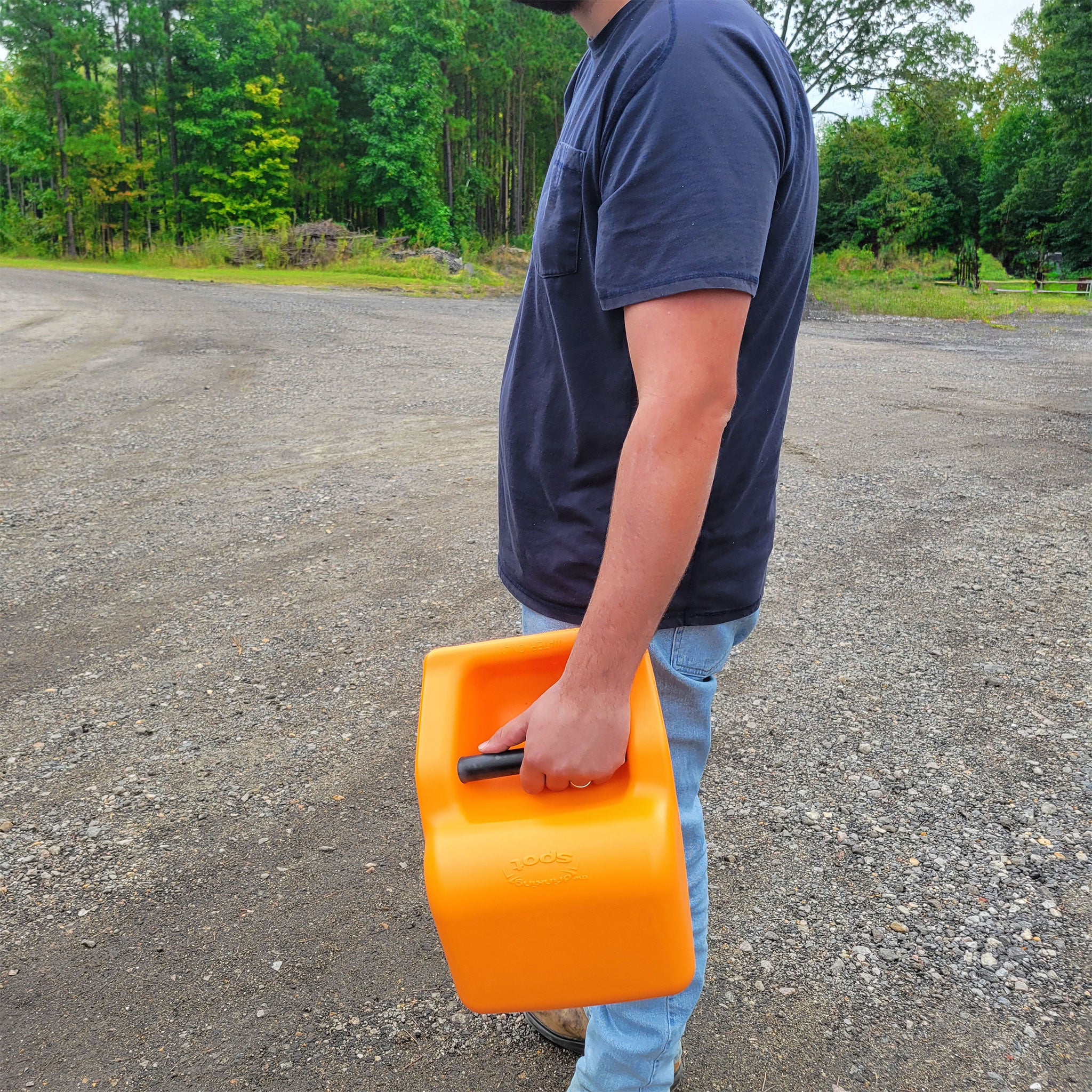 guy carrying Gravity Dog Water Dispenser 