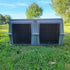 The Duece Kennel by Easy Loader Kennels in a grassy field