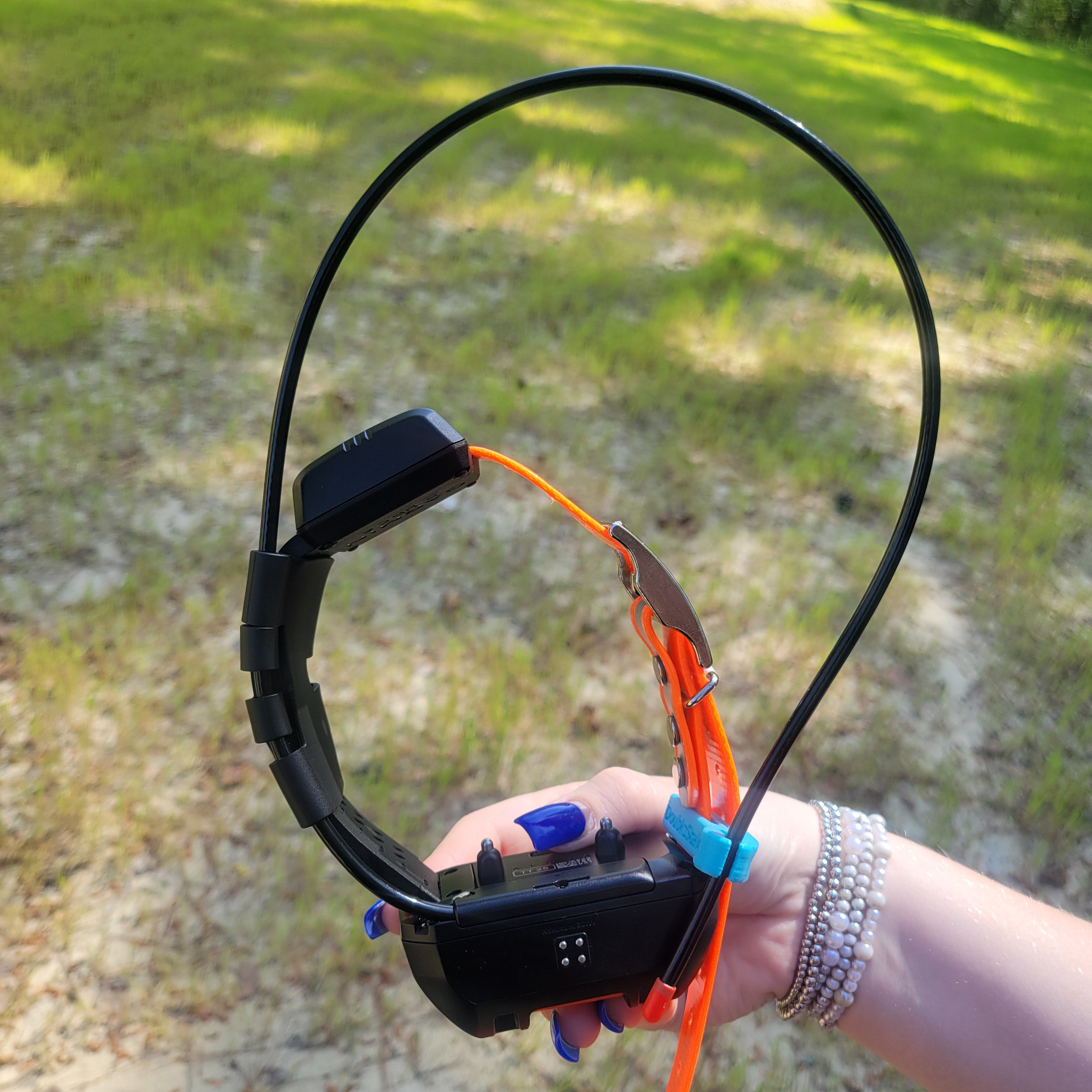 video of the Lester's Stiktite Double Stack Collar Strap Holder being put on Garmin TT25 collar