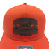 close up of the leather patch that reads "Outdoor Dog Supply www.outdoordogsupply.com (757) 482-1000" on an orange trucker hat
