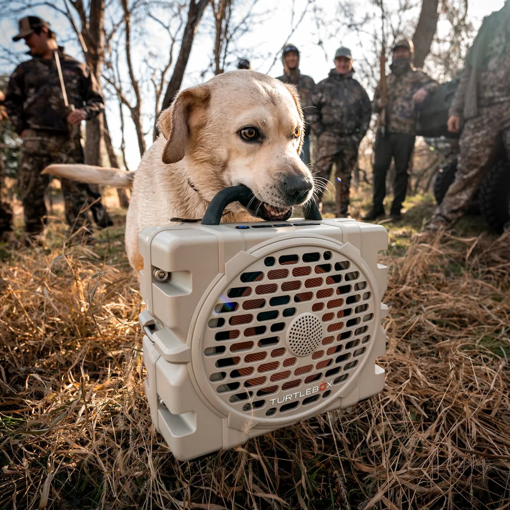 Turtlebox Grande Rugged Portable Outdoor Speaker in dog's mouth