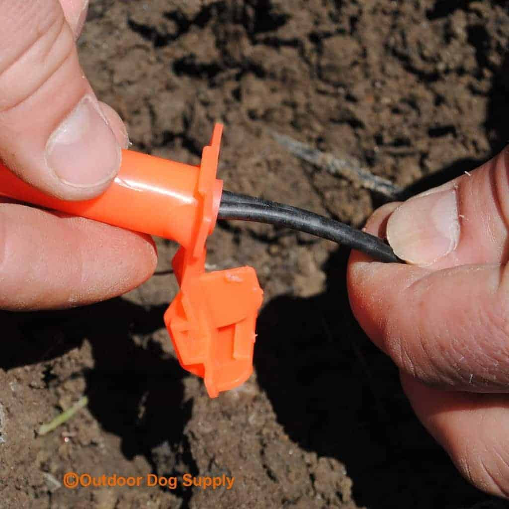 Break Finder Kit Install Splice Kit in ground hand inserting the wire